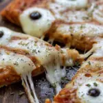 Mummy Face Pizza (Strips Of Mozzarella With Olive Eyes)